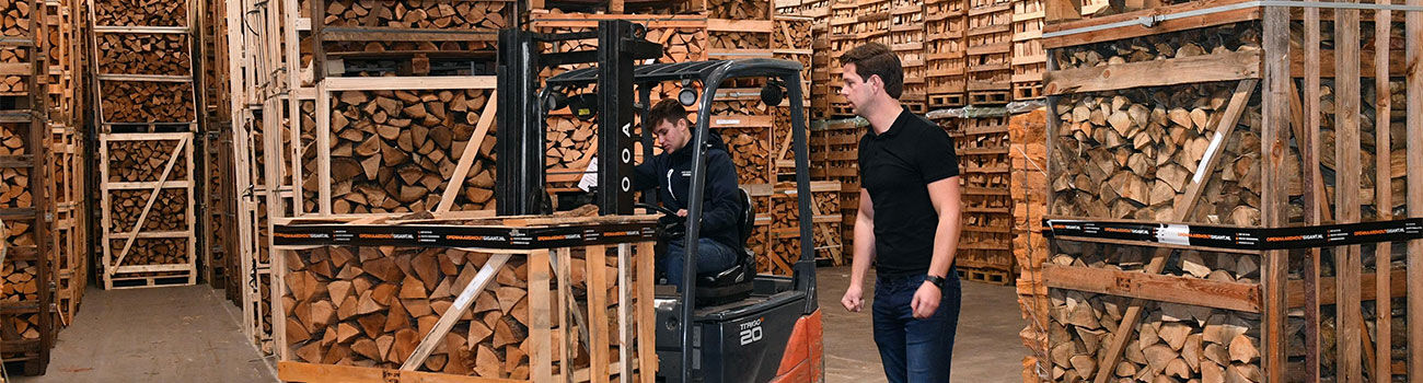 Firewood Giant warehouse with stacked firewood